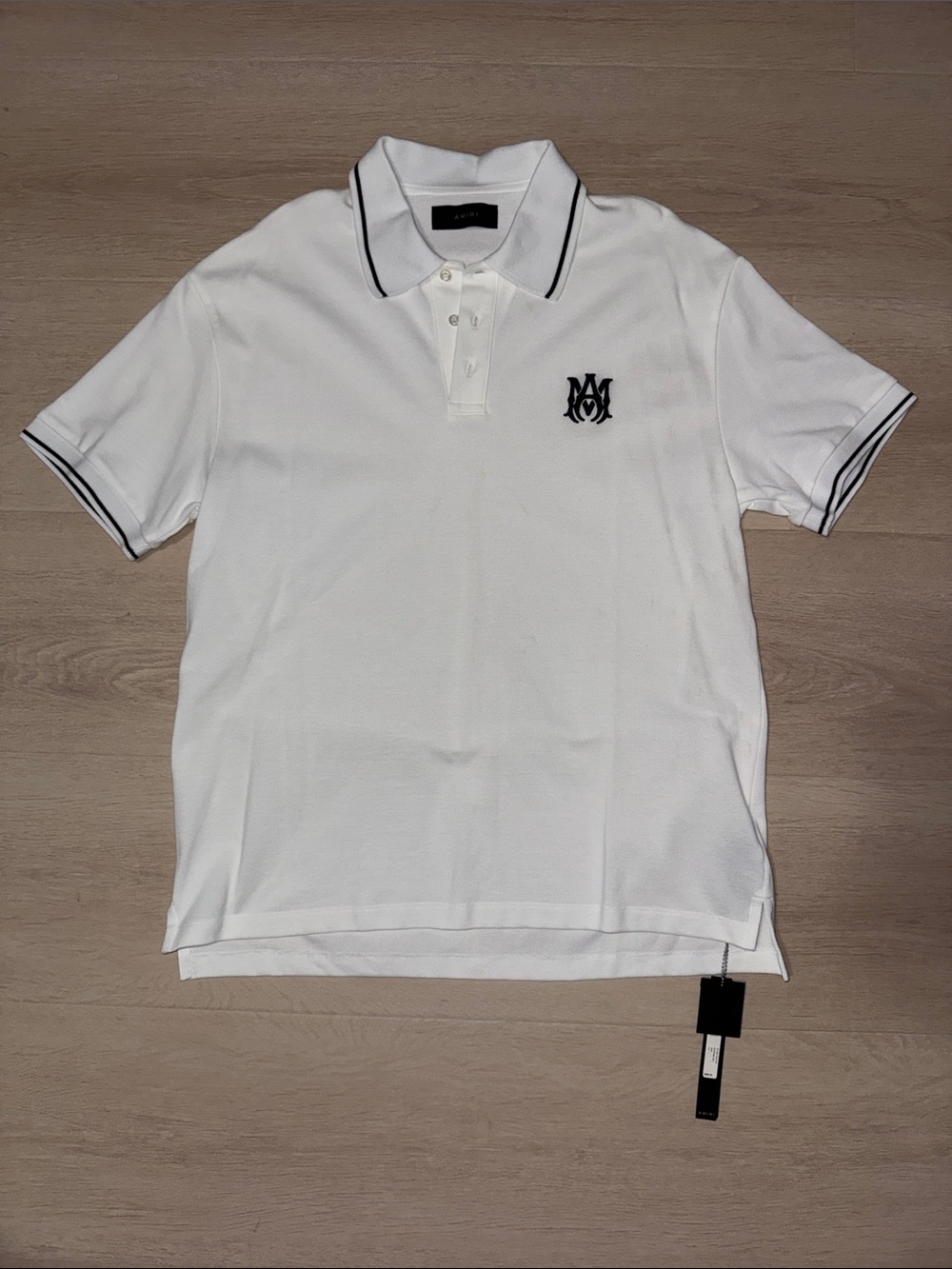 AMIRI Brand New Authentic White Polo with Black Branded Tags & Extra Button.